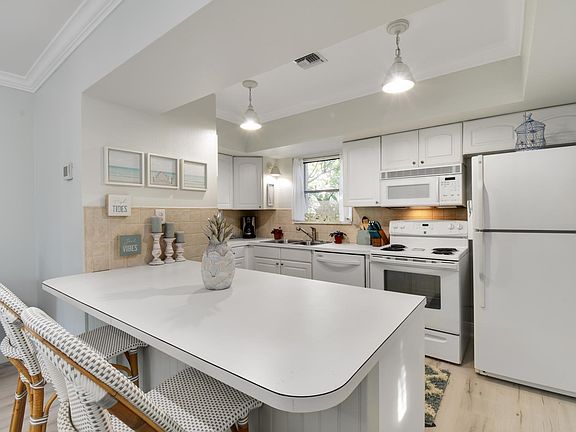 View of kitchen. Lily and Serena Riviera bistro stools.