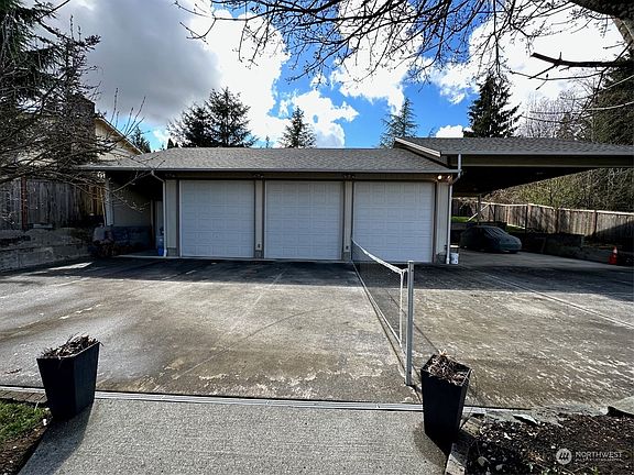1296 sq ft detached 3 bay shop/garage with pickle ball court/or parking area in front.>