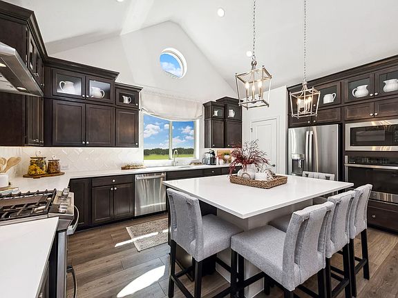 Vaulted ceiling with pendant lighting in kitchen