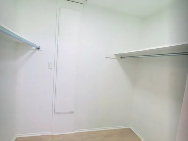 Primary bedroom walk-in closet