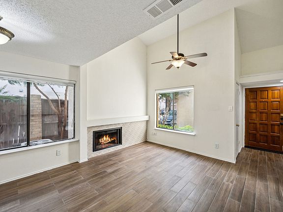 Ceiling fan, fireplace in the living room