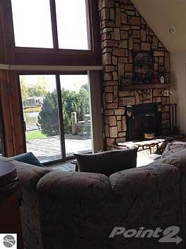 Snuggle up on the sofa with a good book. Enjoy the wood burning fireplace and the view you get from the wall of glass.