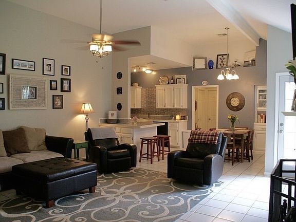 Living and Dining : Photo taken from front door. Open living space, dining space, and kitchen area.