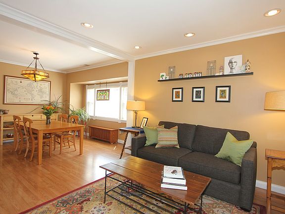 Living room with view into Dining room