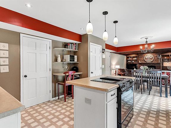 View of kitchen open to breakfast room and family room.
