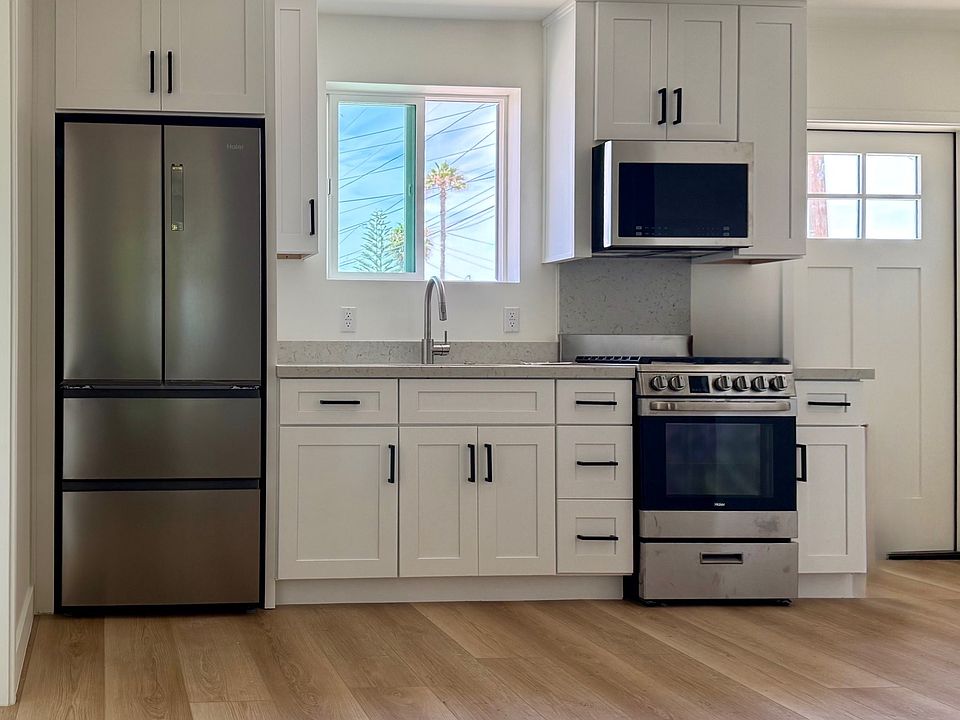 Brand new construction means that you'll be the first to cook in this kitchen with new stainless steel appliances, soft-close cabinetry, quartz slab countertop, and abundant natural light!
