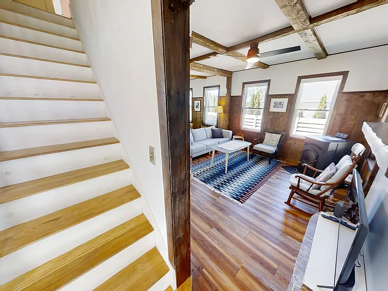 Living area and staircase to second level