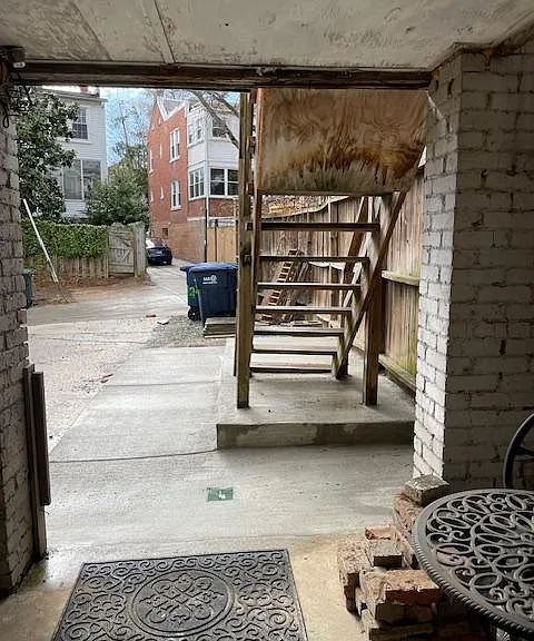 New concrete walkway installed one yearago. View is from door to alley. Yes, there is a small patio, too!