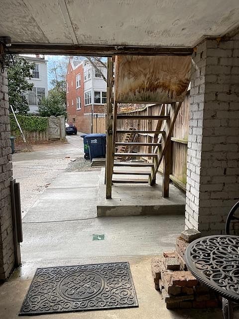 New concrete walkway installed one yearago. View is from door to alley. Yes, there is a small patio, too!