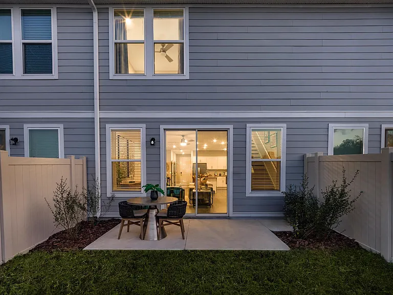 Amavi Kissimmee provides the perfect backyard featuring lush turf grass.