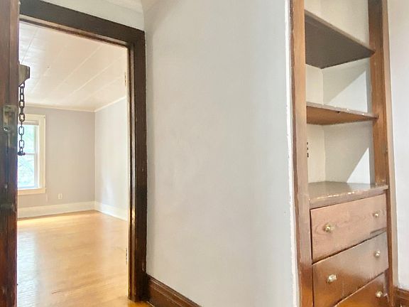 Entry foyer leads into living room to the left