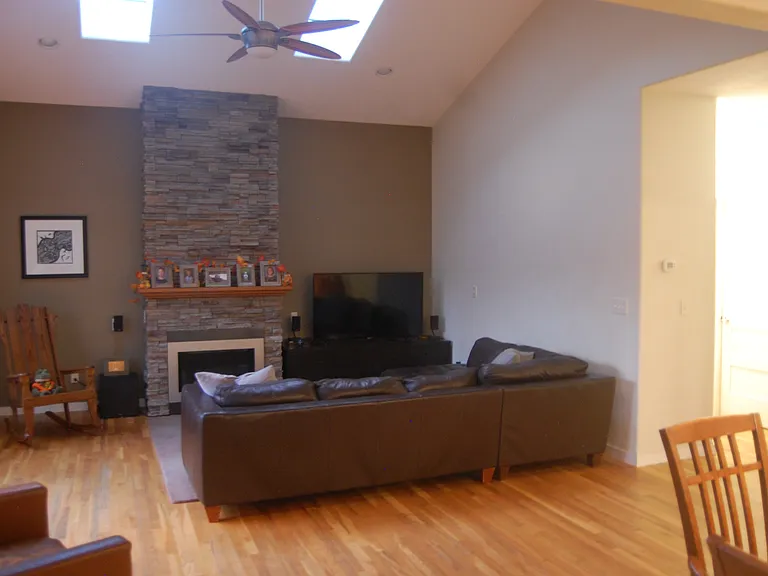 Living Room features Skylights, Valor Gas Fireplace, Ceiling Fan and Wired for Surround Sound Theater.
