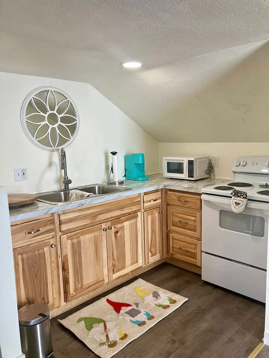 Updated cupboards, flooring, range, Keurig coffee maker, ALL supplied in the cute Kitchen - 1045 NE Cedar St
