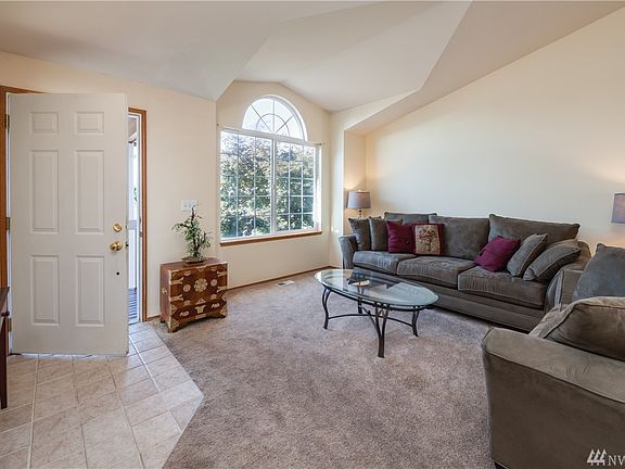 Bright living room with vaulted ceiling