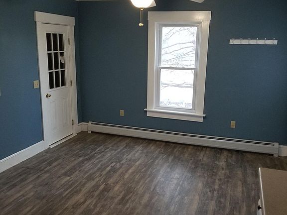 Dining room with door to unheated nook with windows