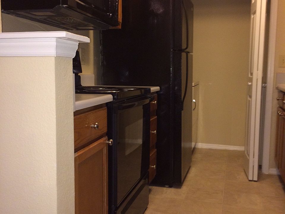 Fully loaded kitchen with black appliances
