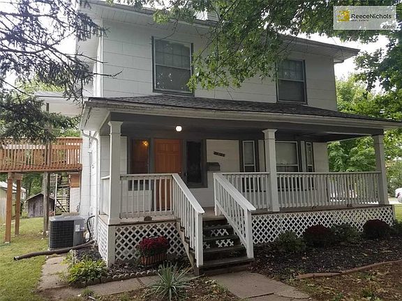 Large front porch plus a deck off the staircase landing.