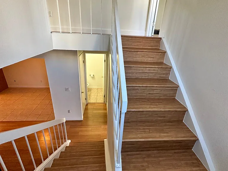 There is a tree that turns pink in the spring that can be seen from window of the stairs landing.