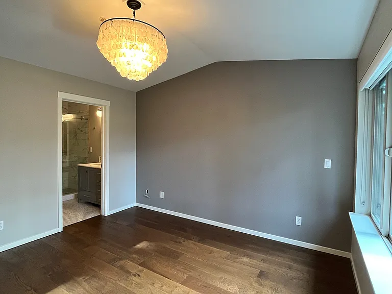 freshly painted accent wall; high vaulted ceiling; 12 x 12 feet