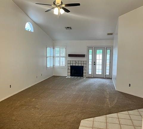 Living Room/great room with fireplace and french doors to backyard