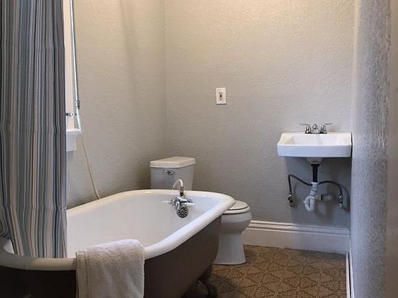 Bathroom with vintage clawfoot tub, new plumbing and paint. 
