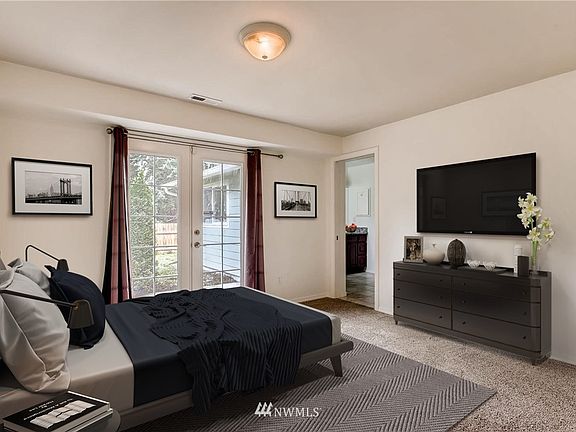 Large primary bedroom is 135 sq ft with private access to back patio and fenced yard. Room comes unfurnished