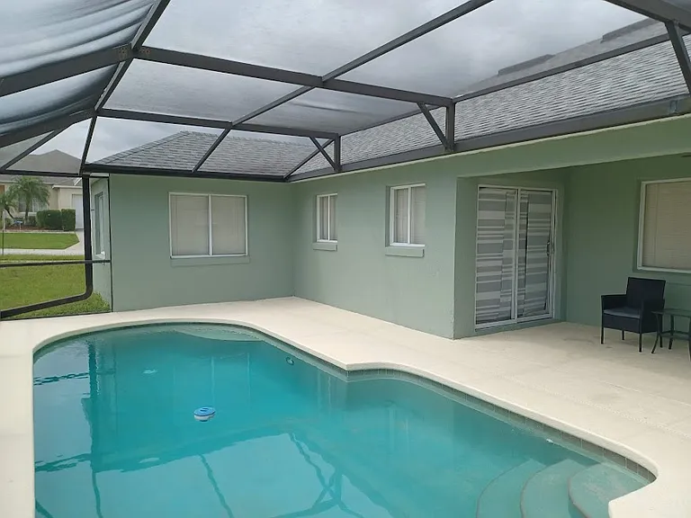 Screened patio with covered dining area. Privacy screens.
