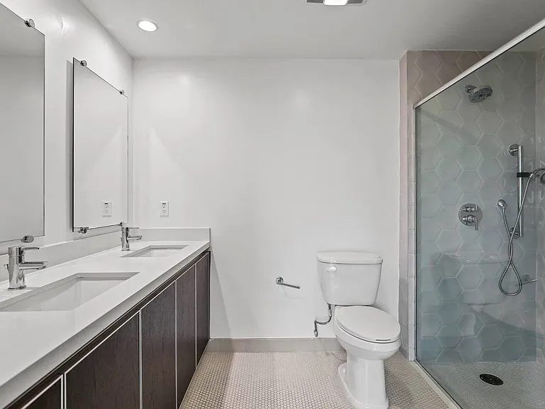 Large-Size Bathroom with Walk-In Shower, Double-Sink Vanity, and Cabinet Storage