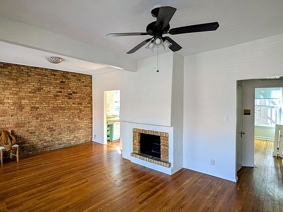 Living room. South brick wall.