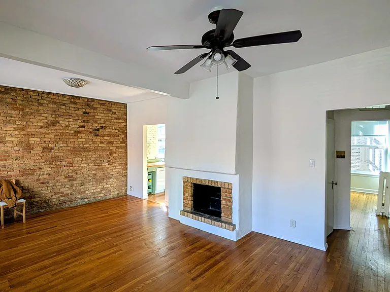 Living room. South brick wall.