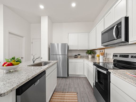 This move-in ready home features gorgeous granite countertops in the kitchen