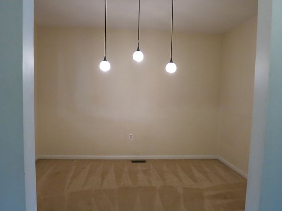 Dining room has updated light fixture.