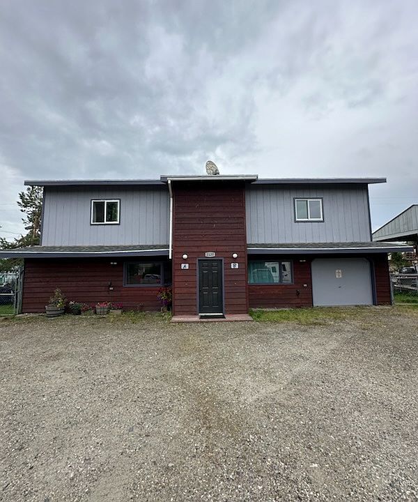 Front view of property, unit is on the left.