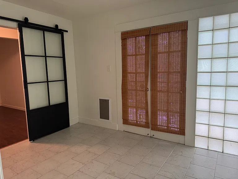 Kitchen w/ french doors to side patio and door to add'l office or drop zone.