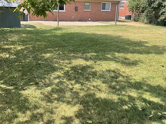 Fenced yard with shed