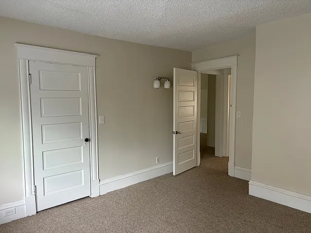 Bedroom looking into hall and living area.
We do not have photos of the apartment furnished.