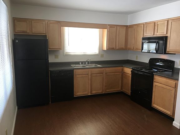 Large fully furnished kitchen with new cabinets and appliances.