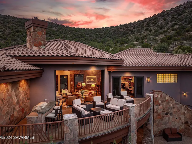 Upper Patio at Dusk with Living Room Beyond and Dining Area to the Right