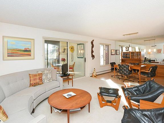 Great access from living to three season porch. Open layout to dining too.