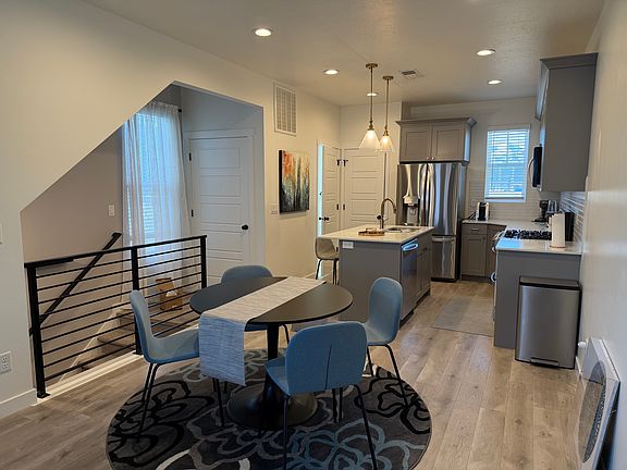 Dining & Kitchen Island, Gas Range, Oven, LG appliances, Microwave, furnished kitchen (utensils, plates, pots, pans), coffee maker, blender