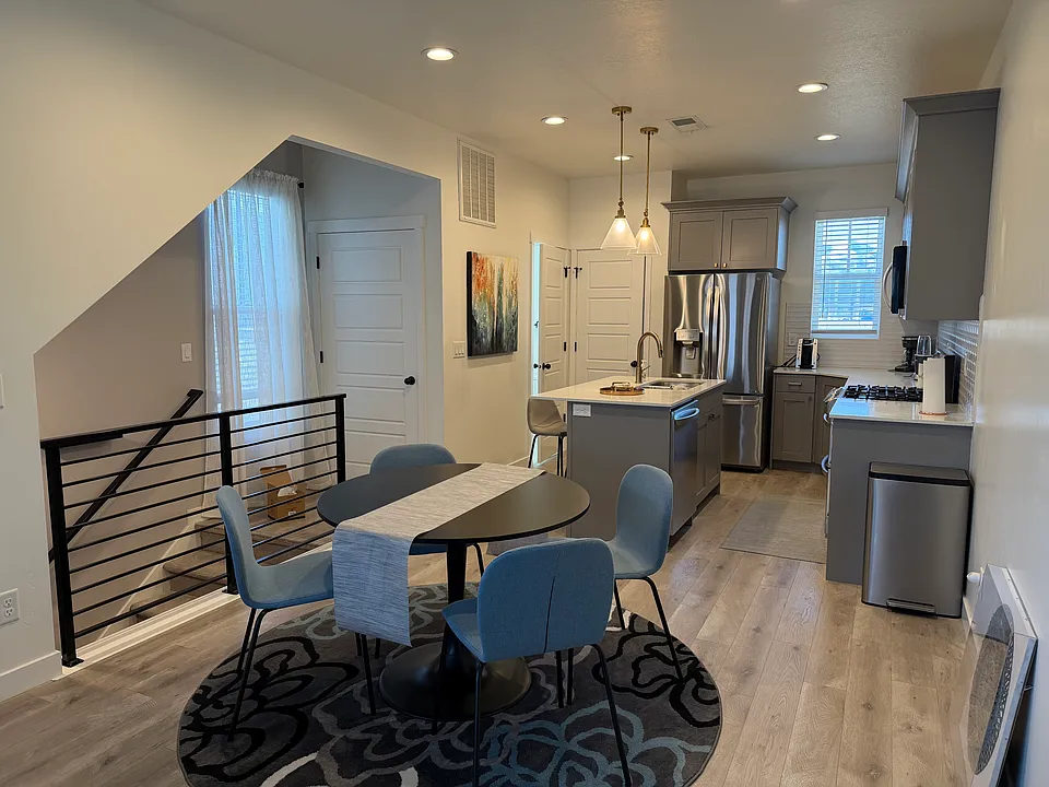 Dining & Kitchen Island, Gas Range, Oven, LG appliances, Microwave, furnished kitchen (utensils, plates, pots, pans), coffee maker, blender