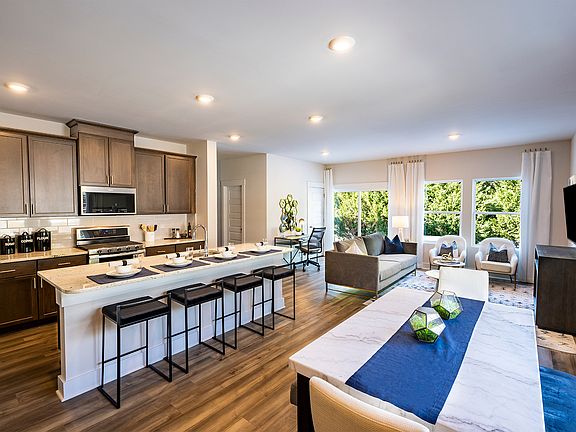 Prep dinner in the kitchen while entertaining in the great room. Photography from Douglas Townes.