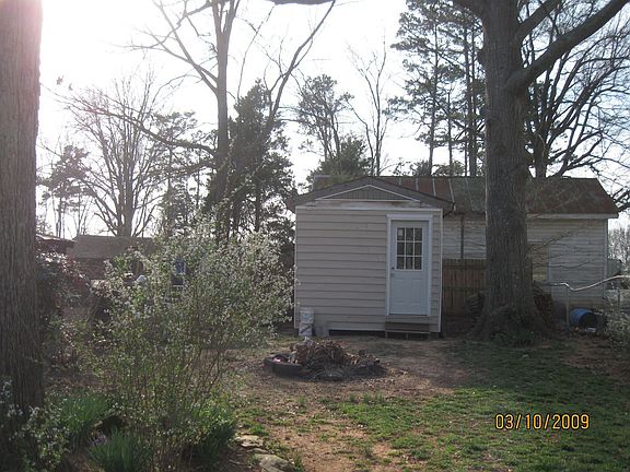 1 of 3 storage sheds/areas in back