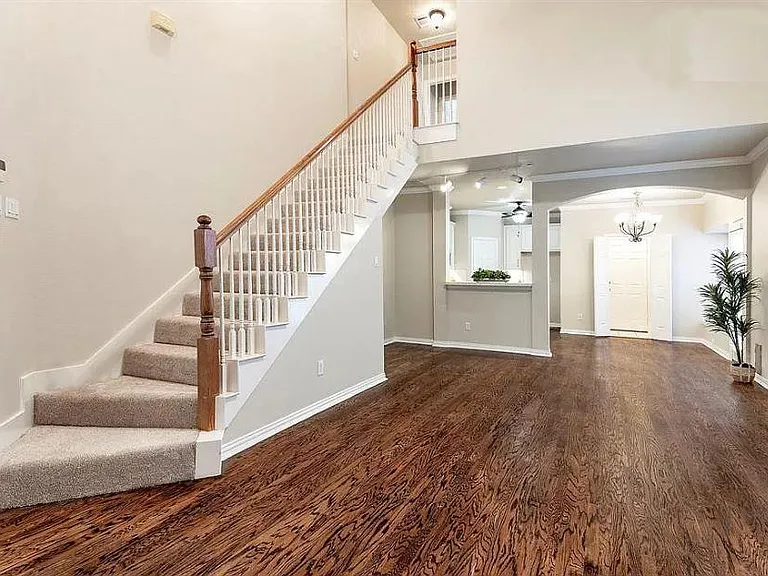 Looking east from Living toward stairs, Kitchen, Laundry & Dining. Office is at top of stairs.