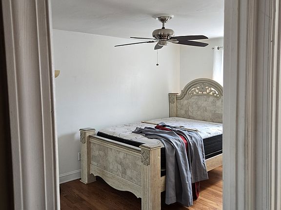 Master Bedroom with curtains on bed
