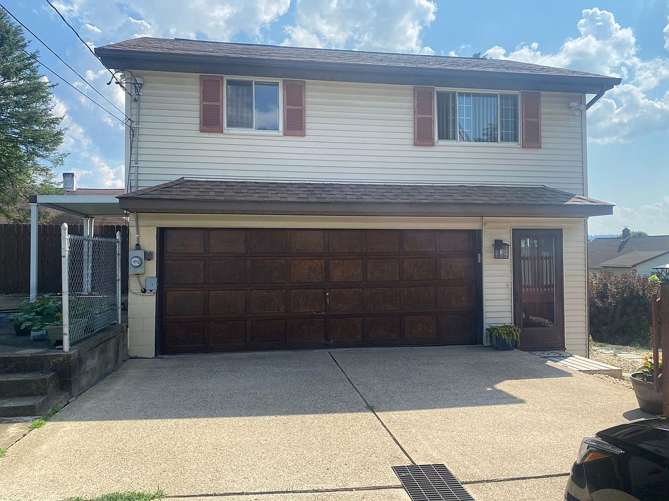 Entrance to garage apartment. Covered patio for garage apartment on left. Half of garage is dedicated to garage apartment for washer/dryer and storage only (no vehicle parking).