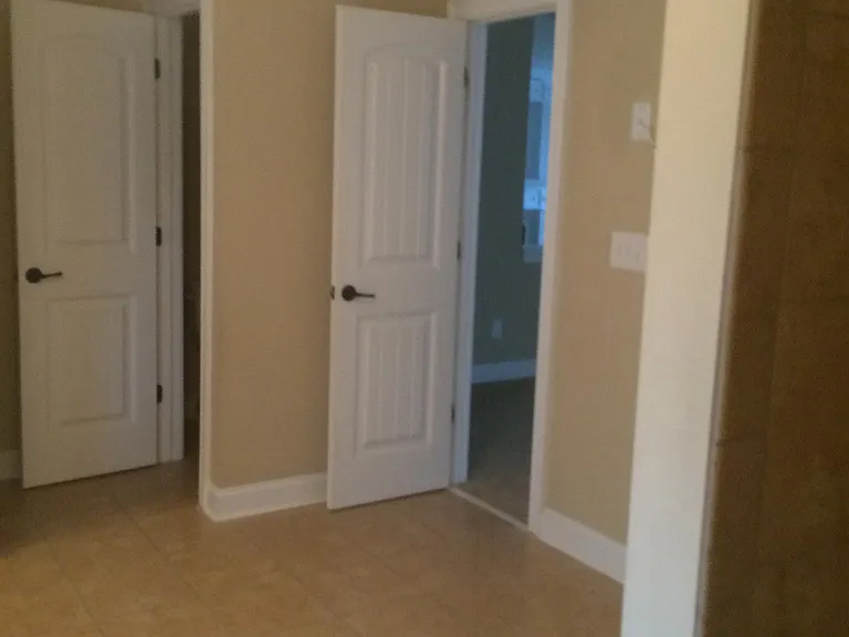 Master bathroom has space for vanity or relaxing furniture.