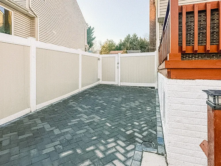 Private fenced backyard with patio space, outdoor seating, and room to relax.