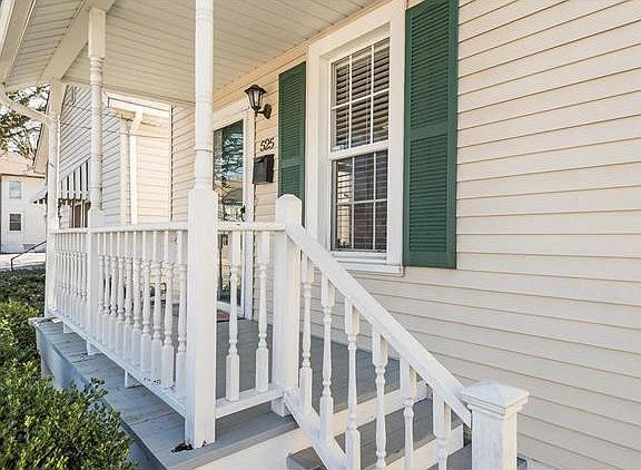 Cute and inviting covered front porch