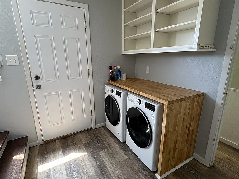 Full size washer and dryer with folding are and lots of storage